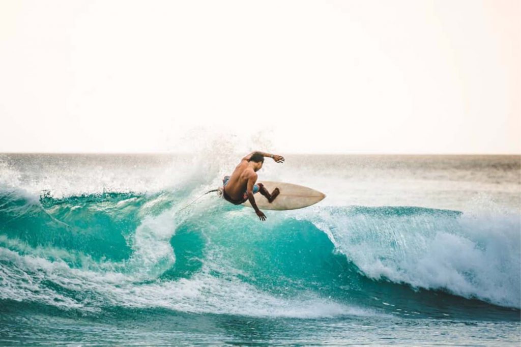 Surfer catching a wave